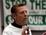 Woman Charged with Stalking Chicago Priest