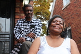<p>The Tates on the front steps of their Englewood home.</p>

