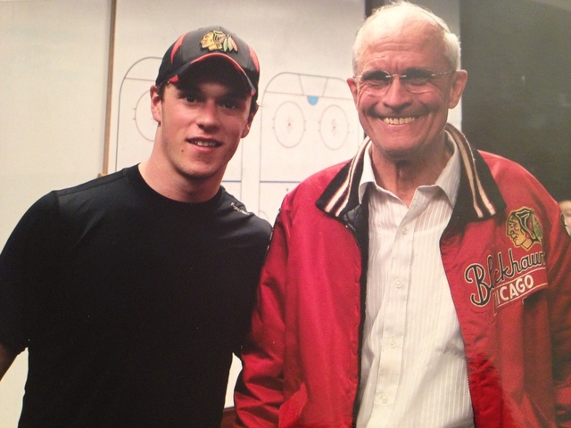 <p>Bob Gertenrich poses with Blackhawks team captain Jonathan Toews in the team's locker room.</p>
