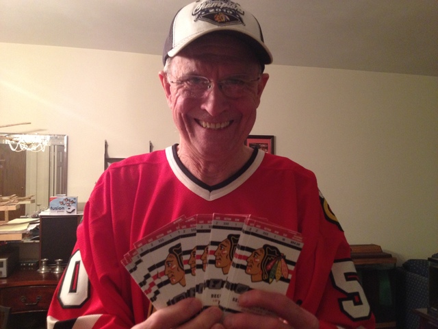 <p>Bob Gertenrich poses with his 2012-2013 Chicago Blackhawks season tickets. This season's NHL lockout has prevented Gertenrich from extending his current streak of attending 2,188 consecutive straight Blackhawks home games.</p>
