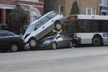 A CTA bus crashed into several parked cars near Kedzie and Diversey.