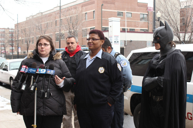 <p>Police dispatchers Michelle Dennis (l.) and Brenda Jones talk on Christmas Day about their efforts to gather Christmas gift donations for the survivors of a deadly Englewood fire.</p>
