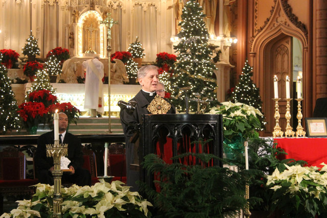 <p>Rev. Richard Fragomeni, of neighboring church Shrine of Our Lady of Pompeii, presents Holy Family Church with relics.</p>
