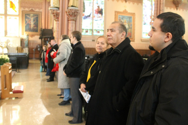 <p>Ben Cardenas Jr, 32, of Palos Hills, stands looking on at the holy relics with his parents, Ben Cardenas Sr and Angelina Cardenis. "It's not something you see every day," Cardenas said.&nbsp;</p>

