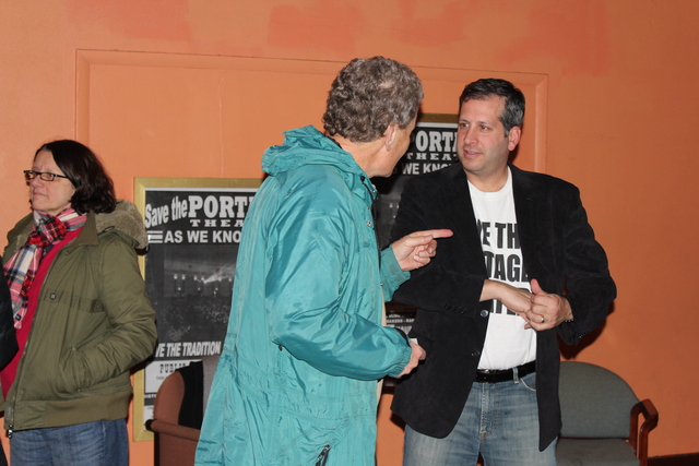 <p>Ald. John Arena (45th) wears a T-shirt emblazoned with the words "Save the Portage Theater" at a rally to raise money for the theater's operators.</p>
