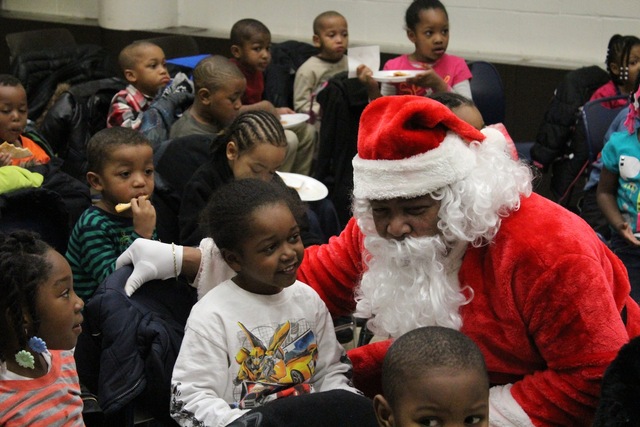 <p>Santa listens to Christmas wishes of preschoolers from the Ada S. McKinley Trumbull Park Head Start program.</p>
