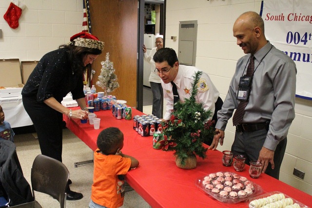 <p>Cmdr. Berscott Ruiz tells a preschooler he must wait for a cookie until he finishes his lunch.</p>
