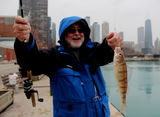 <p>Yessir! On my way back from an appearance on WBEZ's Morning Shift, I spotted Bud Nanney, 62,and his pal Stan Motyko, 47 fishing on the north side of Navy Pier. Ol' Bud reeled in a keeper perch.</p>
