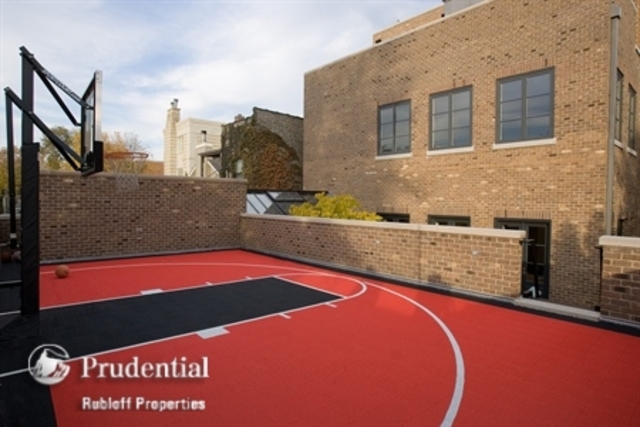<p>The outdoor Sport Court sits on top of the four-car garage.</p>
