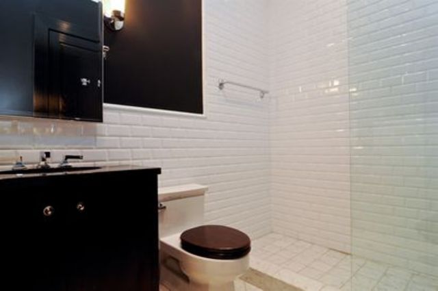 <p>One of the home's seven full bathrooms, on top of three half baths, a sauna, and two resistance pools.</p>
