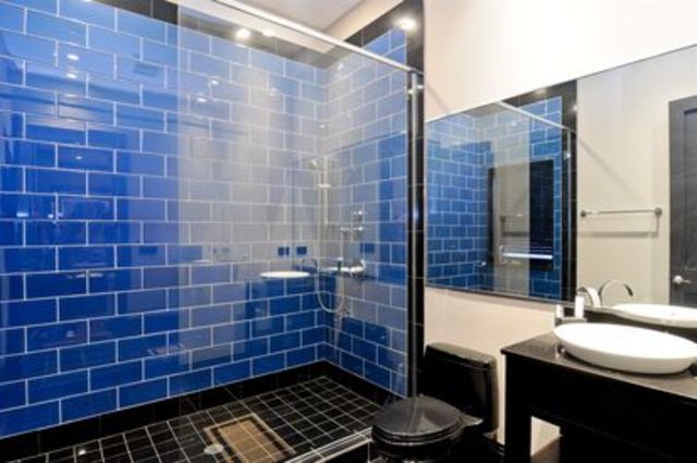 <p>One of the home's seven full bathrooms, on top of three half baths, a sauna, and two resistance pools.</p>
