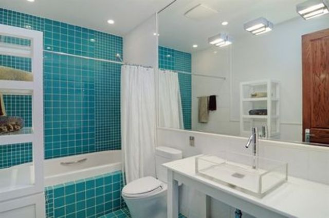 <p>One of the home's seven full bathrooms, on top of three half baths, a sauna, and two resistance pools.</p>
