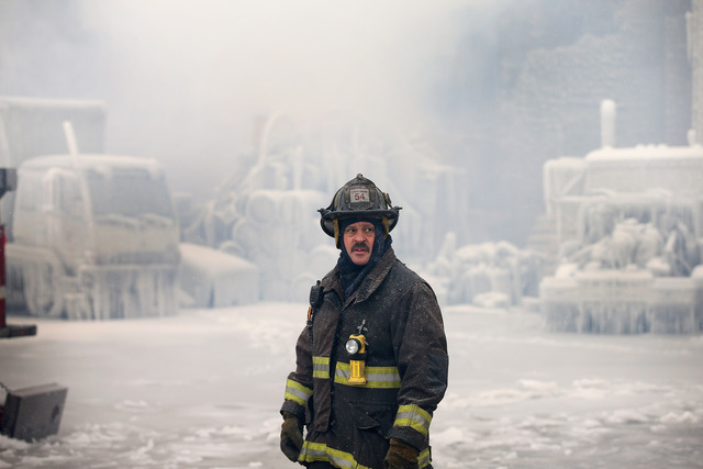 <p>Firefighters work to extinguish a massive blaze at a vacant warehouse on Wednesday in Chicago, Illinois. More than 200 firefighters battled a five-alarm fire as temperatures were in the single digits.</p>

