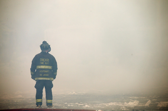 <p>Firefighters work to extinguish a massive blaze at a vacant warehouse Wednesday. More than 200 firefighters battled a five-alarm fire as temperatures were in the single digits.</p>

