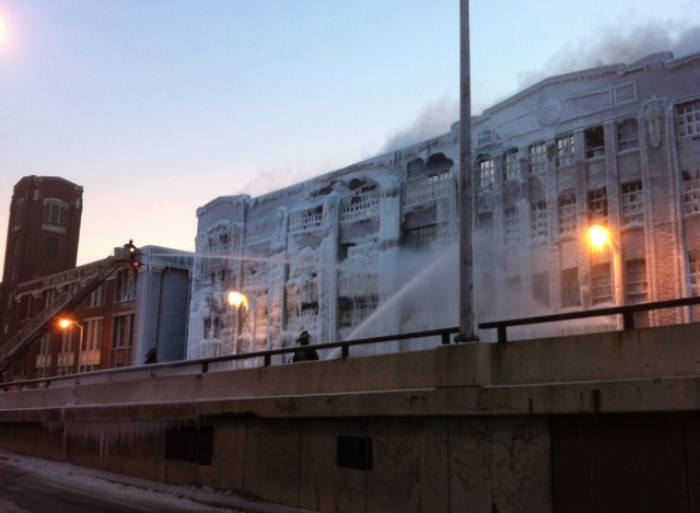<p>Firefighters work to extinguish fire that reignited in a vacant Bridgeport warehouse Thursday.</p>
