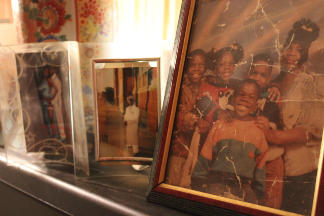 <p>Pictures of Kimberly Common's children rest on top of the television inside her home. Two of her sons, Devin and Antonio, were murdered in less than two years.</p>
