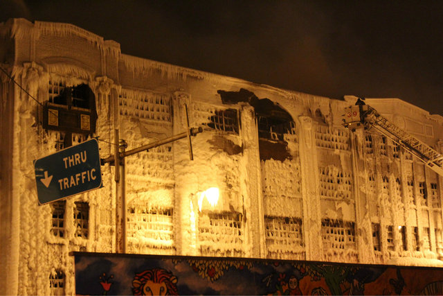 <p>Firefighters continued to douse water on a warehouse the morning after it was engulfed in flames Tuesday night.</p>
