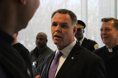 Police Superintendent Garry McCarthy showcases seized guns while calling for tougher gun laws.
