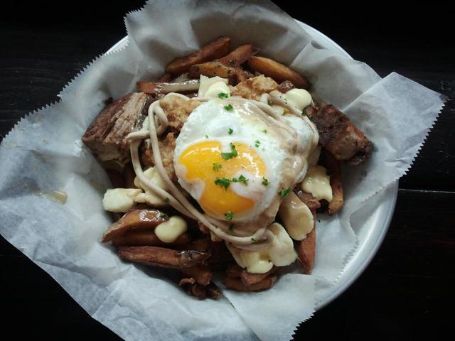 <p>One of BadHappy Poutine Shop's signature dishes, "The Good, The Bad, and the Happy."</p>
