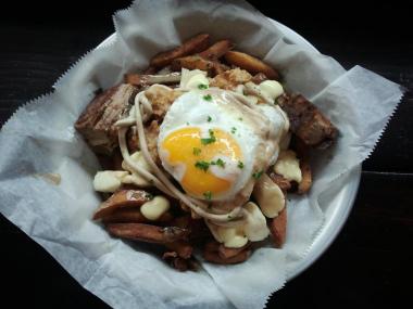 Edgy River North eatery BadHappy is adding its signature french fry dish to its delivery menu starting Thursday.