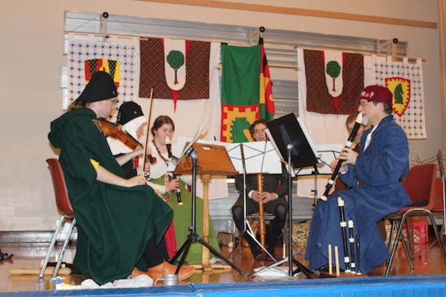 <p>A group of musicians playing instruments from the medieval era entertain the crowd at the&nbsp;Society for Creative Anachronism's celebration of Twelfth Night.</p>
