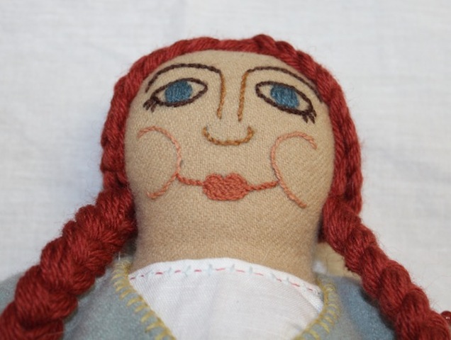 <p>A handmade doll is displayed as part of a competition to win a laurel.</p>

