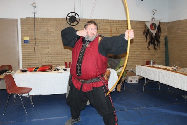 <p>Tom Scrip, known as Aethelwulf in the&nbsp;Society for Creative Anachronism, displays a bow crafted by hand.</p>
