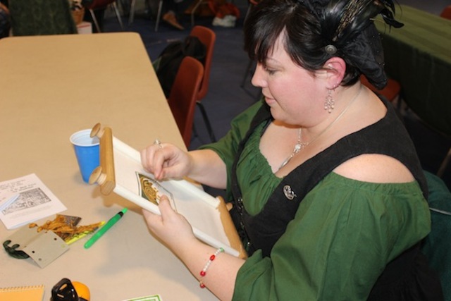 <p>Tamara Planting, of Warren, Ill., demonstrates the art of needlepoint.</p>
