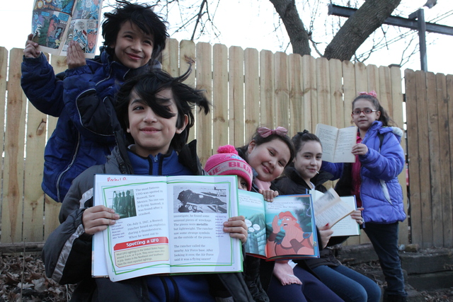<p>The members of The People&rsquo;s Library show off their favorite books.</p>
