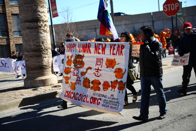 <p>An LGBT-supporting group carries a banner in the 2013 Chinese Lunar New Year Parade in Chicago.</p>
