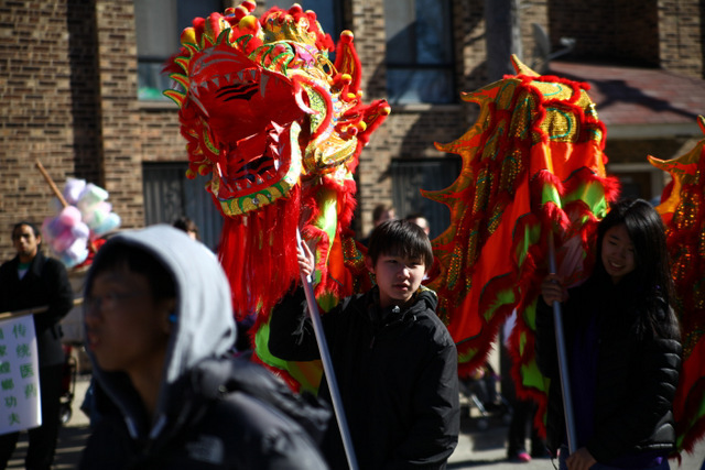 <p>Parade participants proudly display a red dragon at the Chinese New Year Parade in Chicago.</p>
