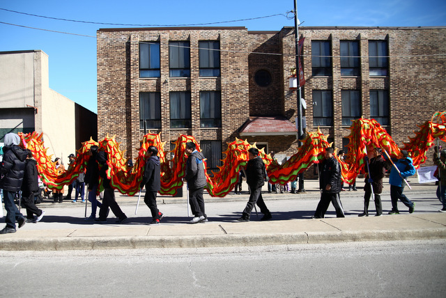 <p>Children dance with a dragon puppet on Wentworth Avenue in Chicago's Chinese New Year Parade on February 17, 2013.</p>
