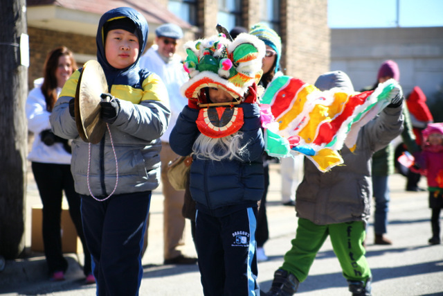 <p>Children dance in a colorful dragon costume at the 2013 Chinese New Year Parade.</p>

