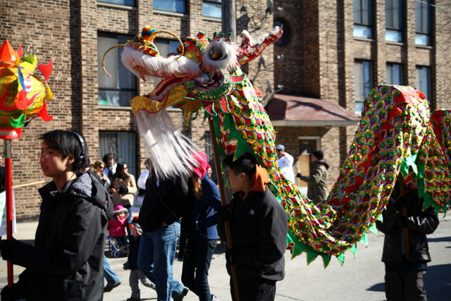 <p>Parade participants dance in a colorful green dragon costume at the 2013 Chinese New Year Parade.</p>
