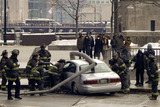 <p>Actors dressed as Chicago firefighters film a scene for NBC's "Chicago Fire" on State Street in River North Tuesday morning. Though they may look like real Chicagoans, the onlookers in the back are extras.</p>