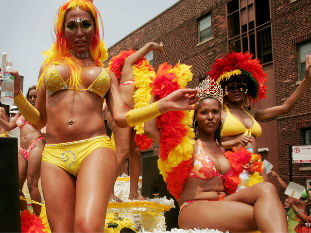 <p>Parade participants dance on a float as it travels through the city's gay district during the 36th annual Gay and Lesbian Pride Parade June 26, 2005.</p>
