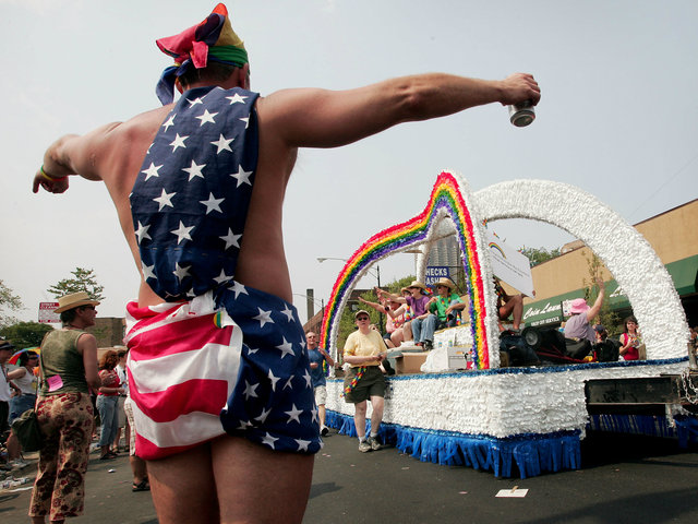 <p>Parade participants dance on a float as it travels through the city's gay district during the 36th annual Gay and Lesbian Pride Parade June 26, 2005.</p>
