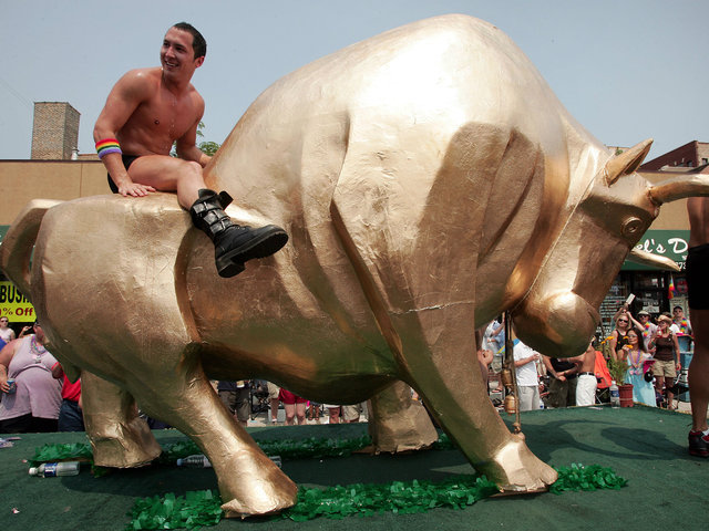 <p>Parade participants dance on a float as it travels through the city's gay district during the 36th annual Gay and Lesbian Pride Parade June 26, 2005.</p>
