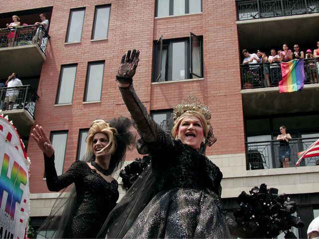 <p>Parade participants dance on a float as it travels through the city's gay district during the 36th annual Gay and Lesbian Pride Parade June 26, 2005.</p>

