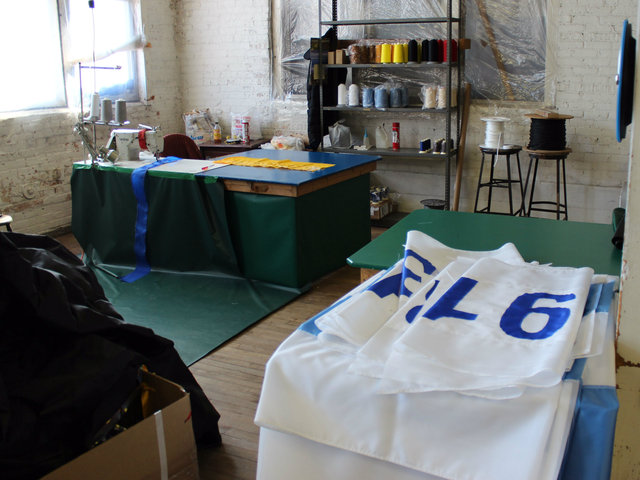 <p>Flags destined for Wrigley Field are draped over a desk in the seamstress wing of the Advertising Flag Co. in McKinley Park.</p>

