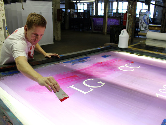 <p>Doug Olson of Advertising Flag Co. works on creating a design that will soon become a flag.</p>
