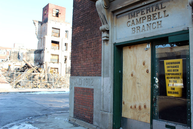 <p>The exterior of the Adverstising Flag Co. building shows its proximity to the Jan. 22 fire that leveled a warehouse next door.</p>
