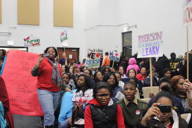 <p>Ryerson Elementary supporters hold up signs at the second CPS Garfield-Humboldt Network community engagement meeting, Wednesday, Feb. 27, 2013.</p>
