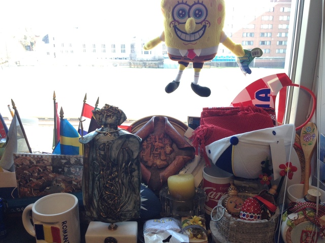 <p>Flags and other memorabilia from the numerous European countries Mark Ardizzone has visited on recruiting trips are in the background.</p>
