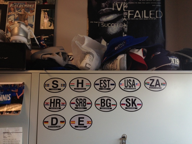 <p>Stickers from the numerous European countries Mark Ardizzone has visited on recruiting trips are in the background.</p>
