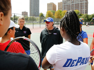 <p>DePaul women's tennis coach Mark Ardizzone poses in his office. Flags from the numerous European countries Ardizzone has visited on recruiting trips are in the background.</p>
