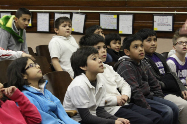<p>Students at McPherson Elementary eagerly await the start of their weekly music lesson with members of Amundsen High School's orchestra.</p>
