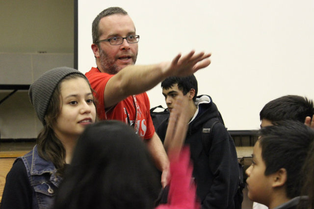 <p>Sean Reidy, director of Amundsen High School's orchestra, organizes music lessons between his students and grade schoolers at McPherson Elementary.</p>
