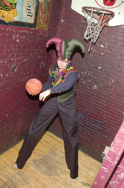 <p>A stilt walker performing at the 2012 "Division Becomes Bourbon" Fat Tuesday festival doesn't need to jump to make a basket.</p>
