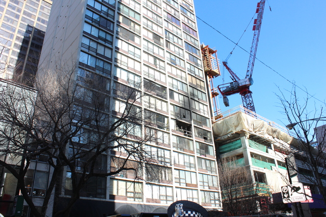 <p>Fire crews cleared out remaining glass from broken windows on the 7th and 8th floors of 230 E. Ontario St.</p>
